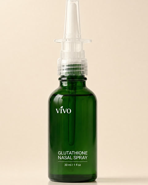 Vivo Glutathione Nasal Spray in a forest green glass bottle, studio photograph