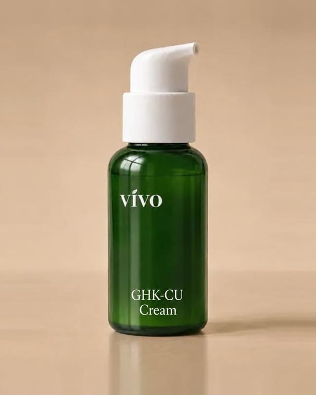 Vivo GHK-Cu Cream in a forest-green pump bottle with a white pump, on a warm tan backdrop