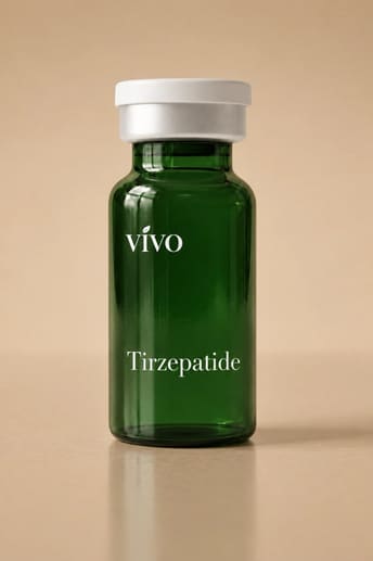 A dark green glass vial labeled Tirzepatide standing on a warm cream background