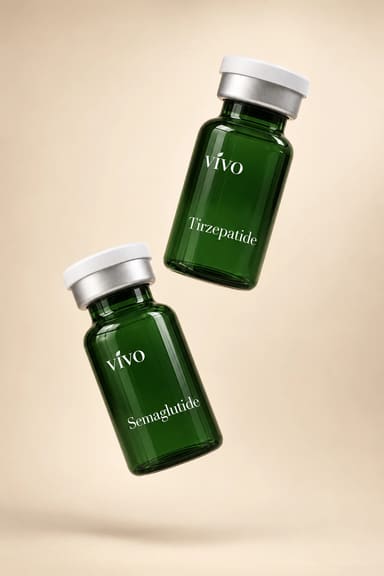 Two dark green glass vials labeled Tirzepatide and Semaglutide, suspended at an angle against a warm sand background