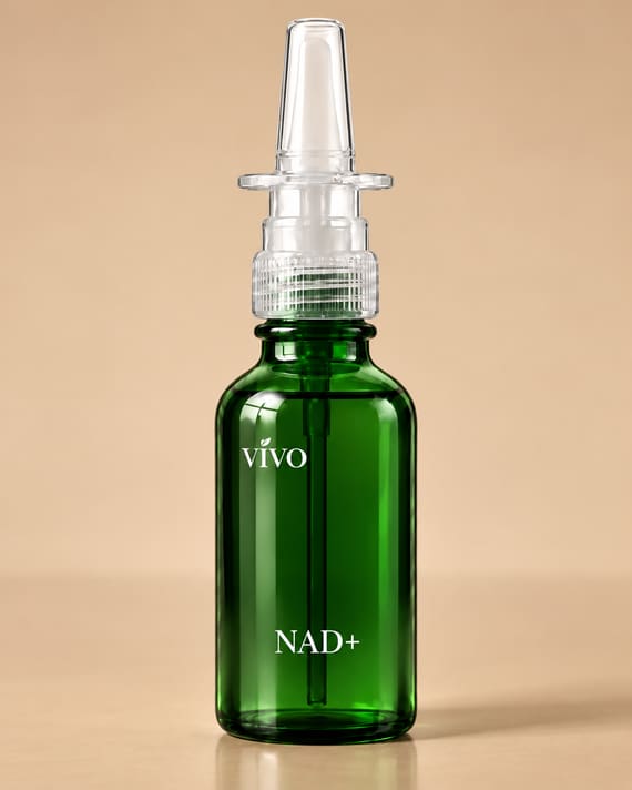 Vivo NAD+ nasal spray in a green bottle with a clear nasal applicator on a tan background